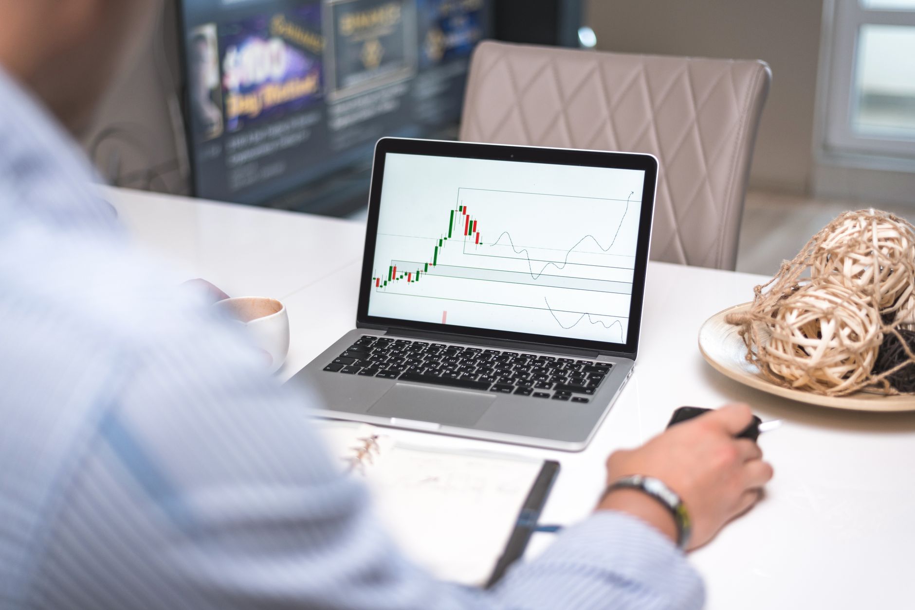 A trader viewing a Discord server on a laptop, illustrating community building for prop firms