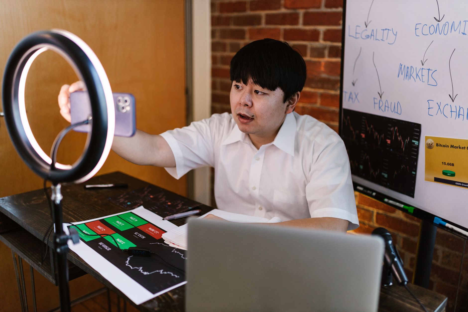 A trading creator recording a video about influencer partnerships in prop trading